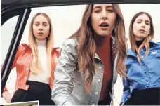  ?? LAURA COULSON ?? Este, left, Alana and Danielle Haim have Something to Tell You, out Friday.