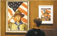  ?? Rick Bowmer / Associated Press 2013 ?? A boy views a Boy Scout-themed Norman Rockwell painting at a Salt Lake City museum in 2013.