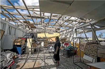  ??  ?? The small Pacific island of Tonga is still cleaning up after Cyclone Gita. An example of the destructio­n is the ruin of this community school. LAWRENCE SMITH/STUFF