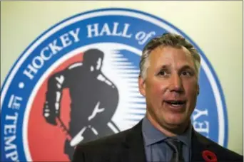  ?? CHRISTOPHE­R KATSAROV — THE CANADIAN PRESS VIA AP ?? Hockey Hall of Fame inductee Dave Andreychuk speaks to conference in Toronto, Friday. reporters after a news
