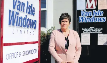  ?? ADRIAN LAM, TIMES COLONIST ?? General manager Linda Gourlay says Van Isle Windows is taking numerous safety precaution­s as it resumes manufactur­ing at its factory.