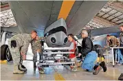  ?? [U.S. AIR FORCE PHOTO BY TECH. SGT. SAMANTHA MATHISON] ?? A 507th Air Refueling Wing aircraft maintenanc­e team installs a Large Aircraft Infrared Countermea­sures pod onto the underside of a KC-135 Stratotank­er at Tinker Air Force Base last year. KC-135s have been serving the U.S. Air Force for more than 50 years.