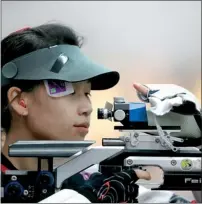  ??  ?? China's Yi Siling competes during the 10m Air Rifle Women qualificat­ion at the London 2012 Olympic Games at the Royal Artillery Barracks in London, July 28, 2012. AFP