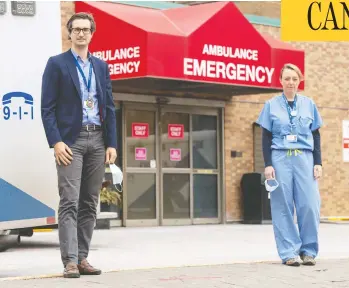  ?? FRANK GUNN / THE CANADIAN PRESS ?? Dr. Jerome Leis and Dr. Lynfa Stroud were at Sunnybrook Hospital in Toronto a year ago, when a patient with what seemed to be mild pneumonia eventually turned out to be “Patient Zero” in the COVID-19 pandemic to come.