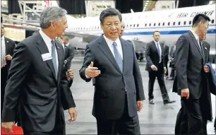 ?? Picture: REUTERS ?? PLANE LANGUAGE: Chinese President Xi Jinping (second left) and Ray Conner (left), president and CEO of Boeing Commercial Airplanes, tour the Boeing assembly line in Everett, Washington, on Wednesday.