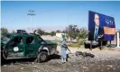  ?? Photograph: Hedayatull­ah Amid/EPA ?? An Afghan security official inspects the scene of a suicide bomb attack that targeted a campaign rally in Parwan province.