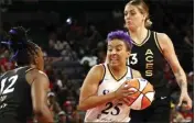  ?? STEVE MARCUS — LAS VEGAS SUN VIA AP ?? Layshia Clarendon, center, scored 22 points to help the Sparks beat the Aces and stay in the WNBA playoff picture.