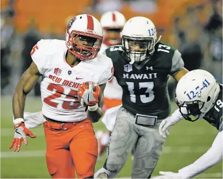  ??  ?? Lobos running back Tyrone Owens, left, escapes Hawaii’s defense during a touchdown run in a 2016 game in Honolulu. Owens received preseason all-Mountain West Conference honors, along with offensive lineman Aaron Jenkins and defensive lineman Garrett...