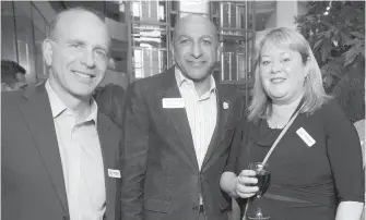  ??  ?? Mark Breslauer from Monk Office, left, joins Al Hasham of Maximum Express and Tammy Averill from Country Grocer.