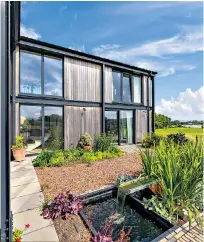  ??  ?? Down on the farm: floor to ceiling windows and a spiral staircase give the barn a modern feel