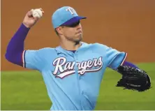  ?? Louis DeLuca / Associated Press ?? Corey Kluber delivers a pitch in a July game in his only start for the Rangers this season. He became a free agent Friday.