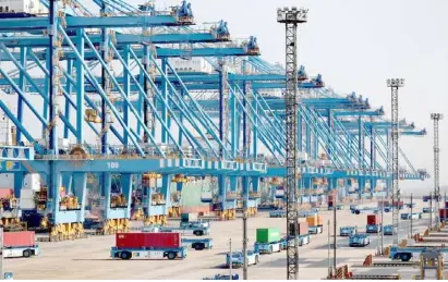  ?? XINHUA ?? AUTOMATIC dock of the Qingdao port in Shandong province bustles with activity. During this year’s Spring Festival holiday, the port handled 12.47 million tonnes of cargo, up 12.8 percent year-on-year.