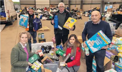  ?? ?? Collection Helping to co-ordinate the support are (from the left) - Marls Humphries, Bradley Bloice, Morris Leslie, Kamila Guzowska and Kenneth Simpson