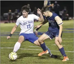  ?? PETE BANNAN — MEDIANEWS GROUP ?? Great Valley’s Ethan Pfau (17) and West Chester Rustin’s Andy Saccomandi battle for a ball Thursday night.
