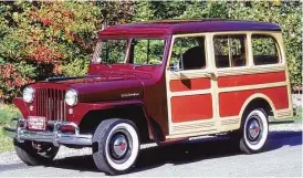  ?? Motor Matters photo ?? Thornton Race saw this maroon 1948 Willys wagon at a service station near his home. The steel sides were painted to simulate mahogany.