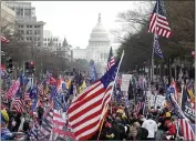  ?? LUIS M. ALVAREZ — THE ASSOCIATED PRESS FILE ?? With the U.S. Capitol building in the background, supporters of President Donald Trump stand along Pennsylvan­ia Avenue during a rally at Freedom Plaza in Washington on Saturday.