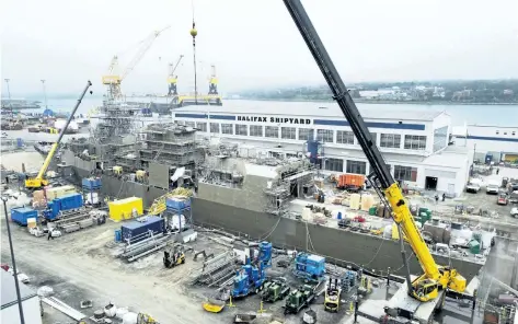  ?? THE CANADIAN PRESS FILES ?? A Navy ship undergoes a mid-life refit at the Irving Shipbuildi­ng facility in Halifax on July 3, 2014.