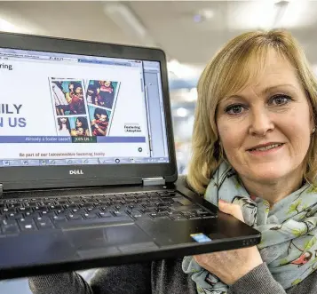  ??  ?? Denise Lacey, county council’s fostering and adoption recruitmen­t manager promoting Leicesters­hire County Council’s new look webpage for its fostering services.