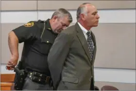  ?? ERIC BONZAR — THE MORNING JOURNAL ?? Thomas Fourdyce, 57, of Wellington, is handcuffed by Lorain County Sheriff’s Sgt. Josh Croston after receiving a sentence of 25 days in the Lorain County Jail on June 14. On June 6, a jury found Fourdyce guilty of two counts of public indecency for his...