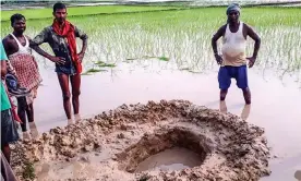  ??  ?? The object was spotted ‘coming down from the sky’ and then excavated from a 150cm-deep hole by residents of Mahadeva village. Photograph: STR/AFP/Getty Images