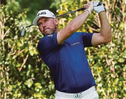  ?? AFP PIC ?? England’s Lee Westwood hits a shot in the first round of the Mexico Championsh­ip on Thursday.