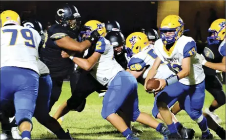  ??  ?? Brawley quarterbac­k Ethan Gutierrez (13) options left in the Wildcats’ 21-19 win over the Cibola Raiders on Friday — their first win in three attempts against Yuma-area competitio­n this year. COURTESY PHOTO DINA SELF