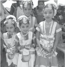  ??  ?? Dancers are dressed up to celebrate the opening of a mangrove protection centre in Sri Lanka.