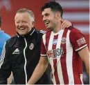  ??  ?? John Egan with manager Chris Wilder