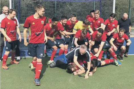  ??  ?? City of Peterborou­gh celebrate their East Premier A Division title win and a return to the National League.