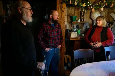  ?? Submitted Photo ?? Alex Leslie, center, stands with his parents, Howard and Tina Leslie in their kitchen on March 8 in Enon Valley, Pa.