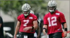  ?? GERALD HERBERT — THE ASSOCIATED PRESS ?? Saints quarterbac­k Taysom Hill (7) and Tom Savage (12), of Cardinal O’Hara, warm up during practice in Metairie, La., on Wednesday.