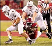  ?? NWA Democrat-Gazette file photo ?? Arkansas sophomore defensive end T.J. Smith (52), shown last season against Texas State, has leaped from 283 pounds to 298 since the end of spring practice while maintainin­g his speed.