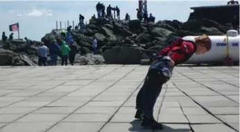  ?? MARK RICHARDSON PHOTOS/TORONTO STAR ?? The wind was powerful at the summit of Mount Washington, as Tristan Richardson demonstrat­es here.