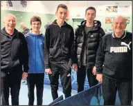  ??  ?? ■ Coaches Eric Baker (left) and Tony Cook (right) with players at Loughborou­gh and District Table Tennis League’s annual tournament held at Draycott TTC.