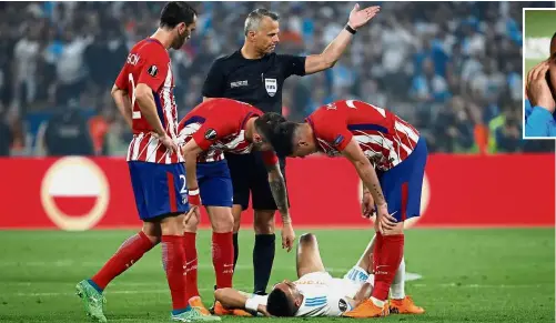  ?? — Reuters / AFP ?? That fateful night: Marseille’s Dimitri Payet lying on the pitch after sustaining an injury during the Europa League final against Atletico Madrid in Lyon on Wednesday.