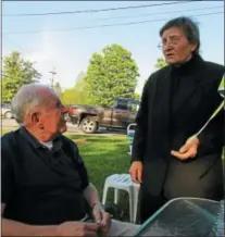  ?? PHOTO SPECIAL TO THE DISPATCH BY MIKE JAQUAYS ?? Back Street Mary Messere, right, chats with Bruce Burke during the May 23ice cream social at the old auction barn in Eaton. Messere returned to the local lecture circuit that evening after three years of illness.