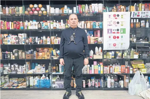  ?? PHOTOS BY THE NEW YORK TIMES ?? Andrei Trubnikov, the founder of Natura Siberica, poses in the company’s offices in Moscow surrounded by bottles and beauty products he has bought on his travels for inspiratio­n and comparison for packaging.