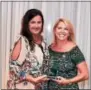  ??  ?? The Malvern School of Erial in New Jersey took home this year’s Presidents’ Choice award. Jennifer DeLaney, left, accepts the award from Kristen M. Waterfield, right, president and co-founder.