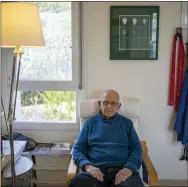  ?? AP PHOTO/ARIEL SCHALIT ?? Holocaust survivor Maurice Gluck, poses for a photo in his home in Ya’ad, northern Israel. Shortly before they were rounded up by Nazi troops in Belgium and deported to Auschwitz in 1942, the parents of three-year-old Maurice Gluck placed their only child in the care of a local Christian family. Gluck forgot his Yiddish mother tongue and that he even had parents of his own.