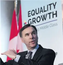  ?? JUSTIN TANG / THE CANADIAN PRESS ?? Finance Minister Bill Morneau and his provincial counterpar­ts must be cognizant of the effect Donald Trump’s business tax cuts and threats to NAFTA are having on Canadian business, writes Kevin Carmichael.