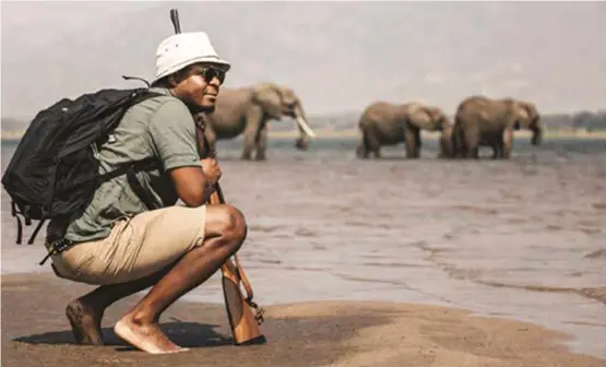  ??  ?? Safari pioneer Beks Ndlovu at Nyamatusi Camp in Zimbabwe.