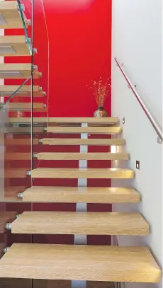  ??  ?? Open treads and glass walls are common staircase features in contempora­ry homes. Staircases can visually expand an interior.