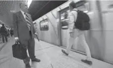  ?? BERNARD WEIL/TORONTO STAR ?? . Lawyer David Lepofsky makes his way along a centre platform at York Mills subway station, searching for the tactile yellow strip at the edge.