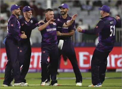  ?? ?? Chris Greaves (centre) celebrates with his Scotland team-mates after their win over Bangladesh