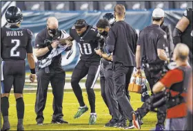  ?? Derik Hamilton The Associated Press ?? Philadelph­ia’s DeSean Jackson was injured against the New York Giants on Thursday, after he caught three passes for 34 yards.