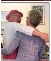  ??  ?? Butcher Paddy Leniston gets a hug from long time customer Peggy Ryan.