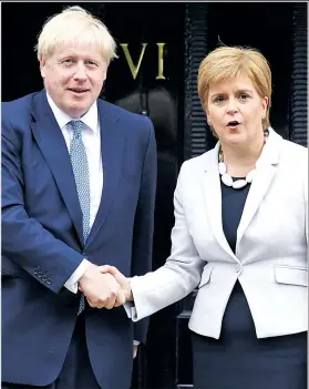  ??  ?? The premier meets Scotland’s First Minister Nicola Sturgeon