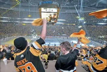  ?? Matt Freed/Post-Gazette ?? Penguins fans cheer as Sidney Crosby takes the ice for Game 3 of the Eastern Conference quarterfin­als against the New York Islanders on April 14, 2019 — long before COVID-19, and long before anyone considered piping artificial crowd noise into PPG Paints Arena.