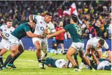  ?? AP ?? South Africa’s Thomas du Toit (left) tackles England’s Nathan Hughes during the second Test in Bloemfonte­in on Saturday.