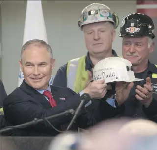  ?? JUSTIN MERRIMAN/GETTY IMAGES ?? U.S. Environmen­tal Protection Agency Administra­tor Scott Pruitt, pictured in April after speaking with coal miners in Pennsylvan­ia, said Monday he will sign a new rule overriding the Clean Power Plan, an Obama-era effort to limit carbon emissions from...